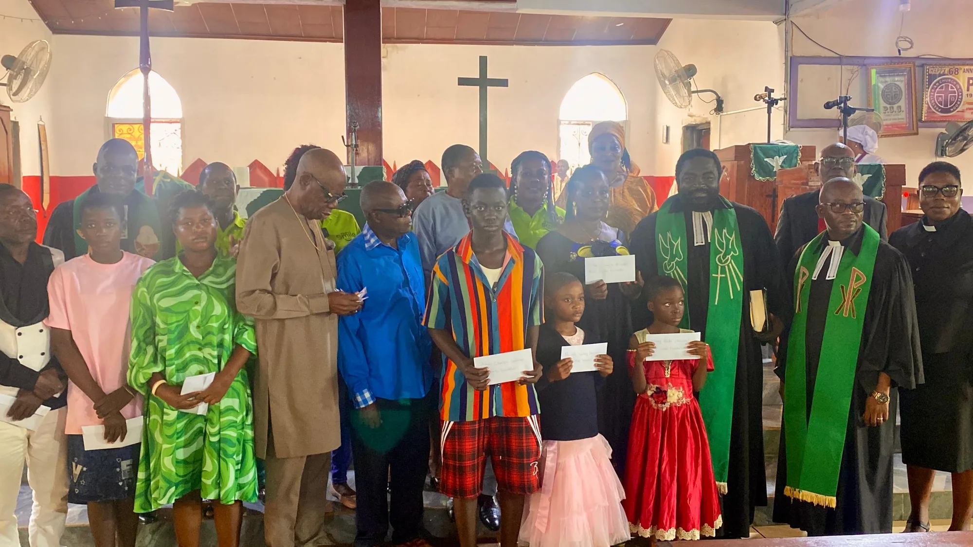 Group picture of Tuition Scholarship beneficiaries, a college of pastors and Smile foundation team