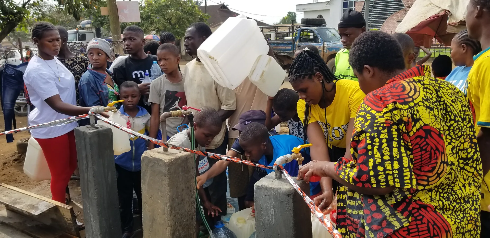 Residents fetching drinking water from borehole provided by the Member of Parliament for Kumba Urban constituency. Hon Tabot Lawson Bakia